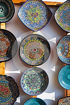 Uzbek ceramic plates hand-painted at oriental street bazaar in Uzbekistan in Tashkent