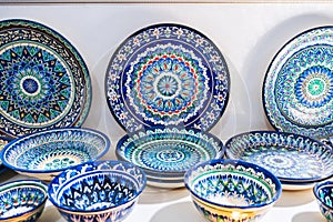 Uzbek handmade ceramic plates with hand-painted with a traditional East Asian pattern in Uzbekistan