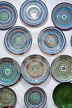 Uzbek handmade ceramic plates with hand-painted traditional Oriental Asian patterns in tableware store
