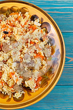 Uzbek pilaf, plov, pilaw with meat, carrot and berberries