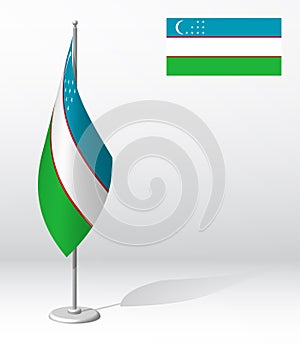 Uzbekistan flag on flagpole for registration of solemn event, meeting foreign guests. National independence day of uzbekistan.