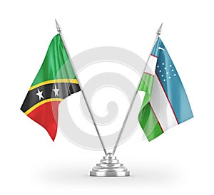 Uzbekistan and Saint Kitts and Nevis table flags isolated on white 3D rendering