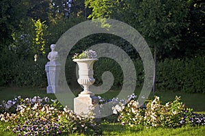 Uzutrakis manor garden with statues and flowers