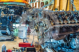 V8 engine from car being rebuilt in garage