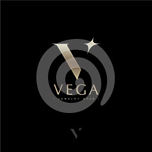 V letter. Vega star astronomy logo. Gold letter V with star. Jewelry emblem.