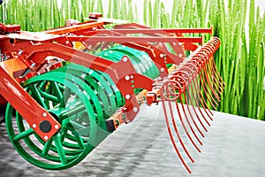 V-ring roller and rows of tines for agricultural