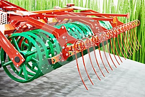 V-ring roller and rows of tines for agricultural