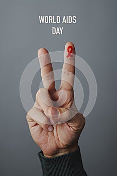 V sign and text world aids day