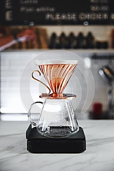 The V60 hario coffee dripper, devices for coffee in the background