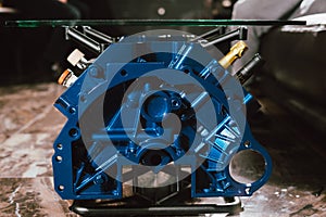 V8 Engine block table, painted in blue color.