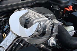 V8 Supercharged car engine and spanner