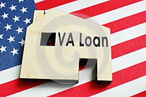 VA loan sign on the home and American flag. photo