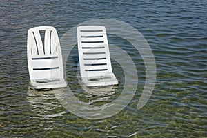 Vacant chairs the sea