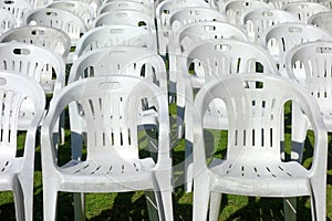 Vacant empty plastic white chairs