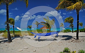 Vacant hammock on a Turks and Cacos beach.