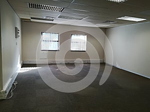 Vacant office or abandoned office space with no people [7]