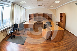 Vacant office or abandoned office space with no people, wide angle view