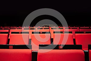 vacant theater with red seats