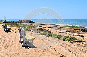 Vacant Wooden Benches on Sandy Beach facing Blue Ocean with Open Sky in Hot Summer - Chorwad, Gujarat, India - Emptiness