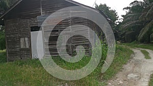 The vacated exterior old wooden building wall texture and fixture.