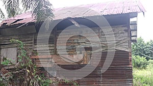 The vacated exterior old wooden building wall texture and fixture.