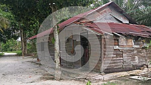 The vacated exterior old wooden building wall texture and fixture.