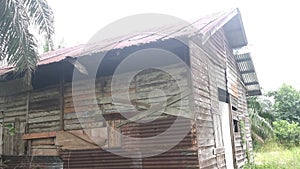 The vacated exterior old wooden building wall texture and fixture.