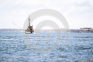 Vacation boat sailing into the horizon