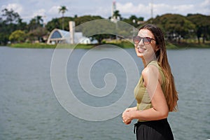 Vacation in Brazil. Traveler woman on Pampulha Lake in Belo Horizonte, UNESCO World Heritage Site, Minas Gerais, Brazil photo