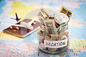 Vacation budget concept with compass, passport and aircraft toy