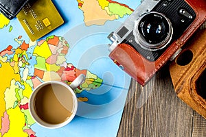 vacation concept with traveller outfit on wooden background top view