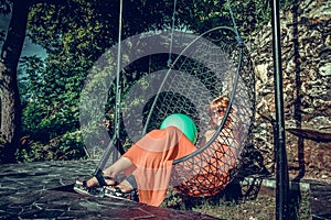 Vacation concept. Young woman swing on tropical island Nusa Lembongan, Bali, Indonesia.