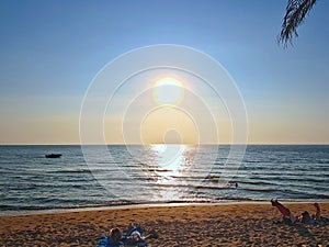 Vacation day at the beach with sun light reflec on sea and sand