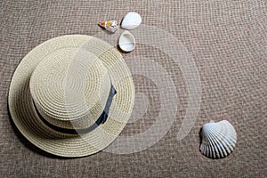 Vacation flat view with straw hat and sea shells photo