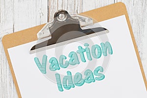 Vacation Ideas message on paper with a clipboard