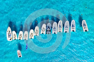 Vacation and leisure. Aerial view on fast boats on blue Mediterranean sea at sunny day. Fast ships on the sea surface.