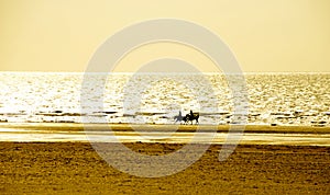 Vacation Lifestyles-Couple Horseback Riding at Sunset