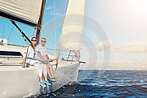 Vacation, ocean and portrait of a couple on a yacht for adventure, freedom and sailing trip. Travel, summer and mature