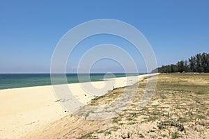 .Beautiful tropical beach, soft wave hitting sandy beach under bright sunny day