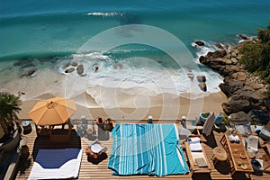 Vacation setup Sandy beach seen from above, bordered by towel and summer items