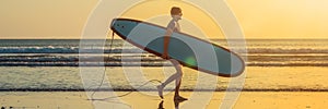 Vacation Silhouette Of A Surfer Carrying His Surf Board Home At Sunset With Copy Space BANNER, long format