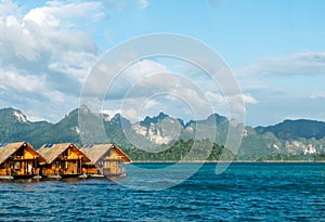 Vacation Start Here Concept, Beautiful Wooden Floating House in Peaceful View of Ratchaprapa dam , Khao sok national park