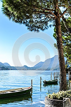 Vacation summer serene Lugano lake surrounded by hills in Morcote