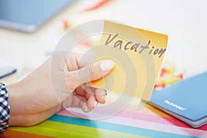 Vacation text on adhesive note