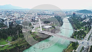 Vacation and travel concept. Aerial view of a small town in the mountains, on the river bank. Podgorica, Montenegro