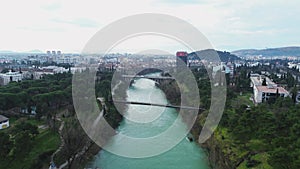 Vacation and travel concept. Aerial view of a small town in the mountains, on the river bank. Podgorica, Montenegro