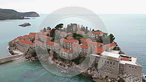Vacation and travel concept. Aerial view of Sveti Stefan, a small town in Mediterranean Sea in Balkans peninsula