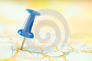 Vacation and travel concept, blue push pin on the map, destination, selective focus photo