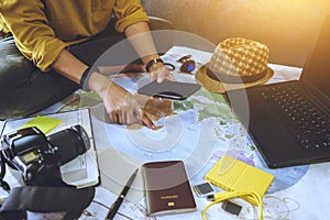 Vacation travel planning concept with map. Overhead view of equipment for travelers. Travel concept background, Young woman