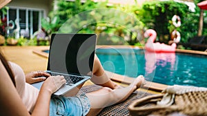 Vacation Woman working on her laptop in holiday  remote online working digital Freelance work concept photo
